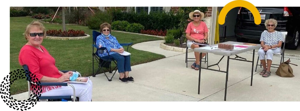 photo: senior adults meeting socially distanced